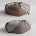 Comfortable Brown And Gray Ottoman With Striped Blanket For Living Room