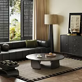 Modern Living Room With Black Leather Sofa Round Coffee Table Floor Lamp And Dark Dresser