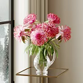 Pink Flowers With Green Leaves In Glass Vase On Table By Window With Snowy View