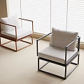 Modern Single Chairs Featuring Black and Brown Frames White Cushions in Bright Room with Blinds