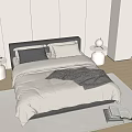 Minimalist Double Bed with Light Beige Quilt Gray Blanket Pillows White Round Nightstands Table Lamps