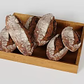 Freshly Baked Rustic Artisan Bread Loaves in Wooden Tray with Flour Dusting