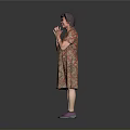 Woman Standing In Floral Dress With Clasped Hands And Purple Shoes On Gray Background