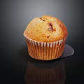 Fresh Baked Muffin With Chocolate Chips in Paper Liner on Black Background with Reflection
