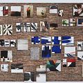 Brick Wall Decorated With Various Photos Artworks And Decorative Items