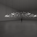 Large Hanging Art Installation with White Geometric Shapes Suspended by Thin Wires in Spacious Gallery