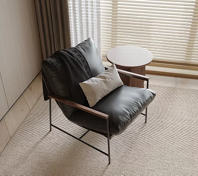 Black Leather Accent Chair With Throw Pillow And Round Side Table On Rug 3d model