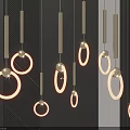 Modern Illuminated Chandeliers With Circular Glowing Rings Hanging On Dark Wall Background