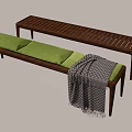 Wooden Chaise Lounge With Green Cushions And Black White Checkered Blanket
