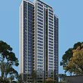 Modern High Rise Residential Building Surrounded by Green Trees Under Blue Sky