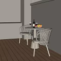 Modern Rattan Outdoor Patio Table and Chairs Set With Wine Bottle Glasses and Fruit Plate