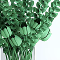 Beautiful Yellow Tulips With Green Leaves In Transparent Glass Vase
