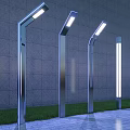 Modern Outdoor Lights With Stainless Steel Poles Along Garden Path And Bright LED Glow