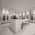 Modern Clothing Store Interior With Clothing Displays Hangers And White Counter