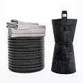 Stacked Gray Towels And Textured Black Bottle For Daily Washing Essentials