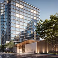 Modern Hotel Building With Glass Facade And Surrounding Trees On Urban Street