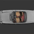 Silver Vintage Convertible Car With Tan Leather Seats And Sleek Body Design