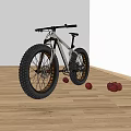 Fat Tire Mountain Bike with Large Wheels on Wooden Floor and Red Balls