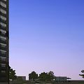 Modern High Rise Residential Building With Glass Facade And Contemporary Design Elements