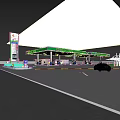 Petronas Gas Station At Night With Green Canopy Fuel Pumps And Parked Car