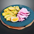 Fresh Avocado Slices with Ham Slices and Sliced Boiled Egg on Blue Plate
