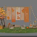 Autumn Themed Outdoor Art Installation With Maple Leaves Banners String Lights and Pumpkins