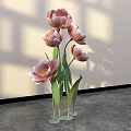 Floral Display With Pink Tulips Green Stems And Metal Bases On Gray Floor