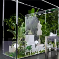 Transparent Exhibition Booth Interior With Green Plants Mannequin Table And Artificial Realm