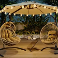 Outdoor Rattan Hanging Chairs with Cushions Under Umbrella String Lights and Wooden Deck