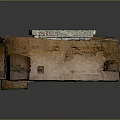 Ancient Stone Columns in Historical Building Interior with Rough Stone Walls and Earthen Floor