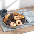 Assorted Donuts On Gray Plate With Gray Cup And Light Blue Cloth On Wooden Table