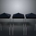 Black Geometric Stools with Angular Tops and Metal Legs on Reflective Floor Against Gray Background