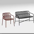 Two Modern Red and Black Metal Wire Design Lounge Chairs with Sleek Structure