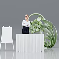 Modern Check-in Desk With Female Staff Easel And Green Plant Decoration