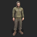 Man in Green Hoodie and Khaki Pants Standing with Brown Boots on Dark Background