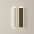 Modern Cylindrical Wall Lamps in White and Dark Brown Illuminated on Beige Wall