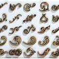 Golden Decorative Sculpture Carvings With Intricate Curved Patterns And Scroll Designs