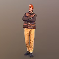 Man In Orange Beanie Patterned Vest Long Sleeve Shirt With Arms Crossed On Gray Background