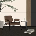 Brown Leather Leisure Chair With Metal Frame Small Round Table Green Plant And Open Book