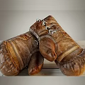 Brown Leather Boxing Gloves with Stitching and Lace-up Design for Sports Training