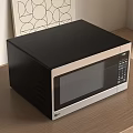 Modern Kitchen Microwave Oven in Black and Silver on Wooden Countertop