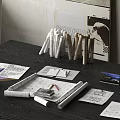 Designer Workspace On Dark Wood Table With Sketches Rolled Papers Pencils Notes And