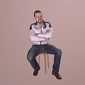 A Man Sitting on Wooden Stool with Crossed Arms in White Jacket and Blue Jeans