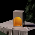 Gray Cubic Wall Lamp With Arched Illuminated Niche Warm Yellow Light Small Figurine Dark Background