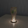 Elegant Woven Table Lamp Casting Radiant Shadow Patterns In Corner