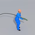 Man wearing blue work uniform and orange safety helmet holding green tool with black cable
