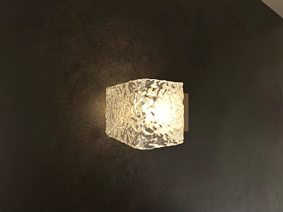 Transparent Textured Glass Wall Lamp Illuminating Dark Wall with Soft Glow 3d model