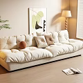 Three Seater Beige Sofa with Pillows Floor Lamp and Wall Painting on Wooden Floor