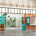 Modern Showroom Interior Design With Glass Partitions Display Cabinets And Green Plants