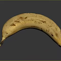 Ripe Yellow Banana with Brown Spots Isolated on Dark Background Close Up View